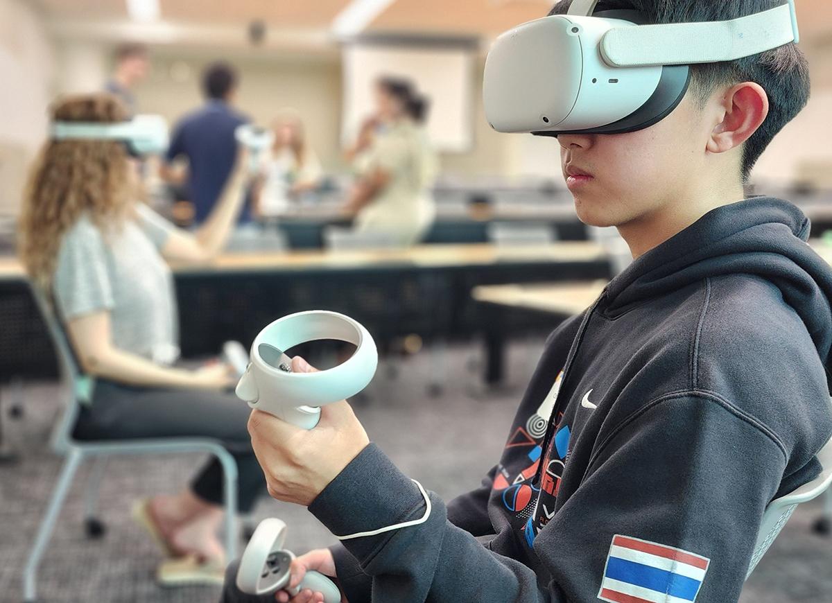 Two young people wearing VR headsets.