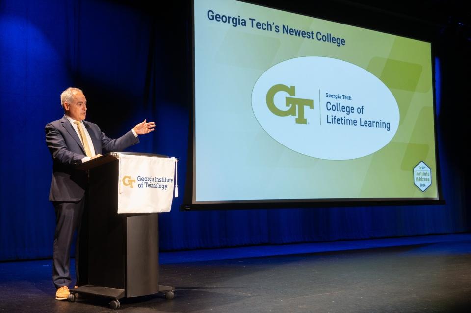 President Cabrera speaking during the Institute Address with the logo of the College of Lifetime Learning